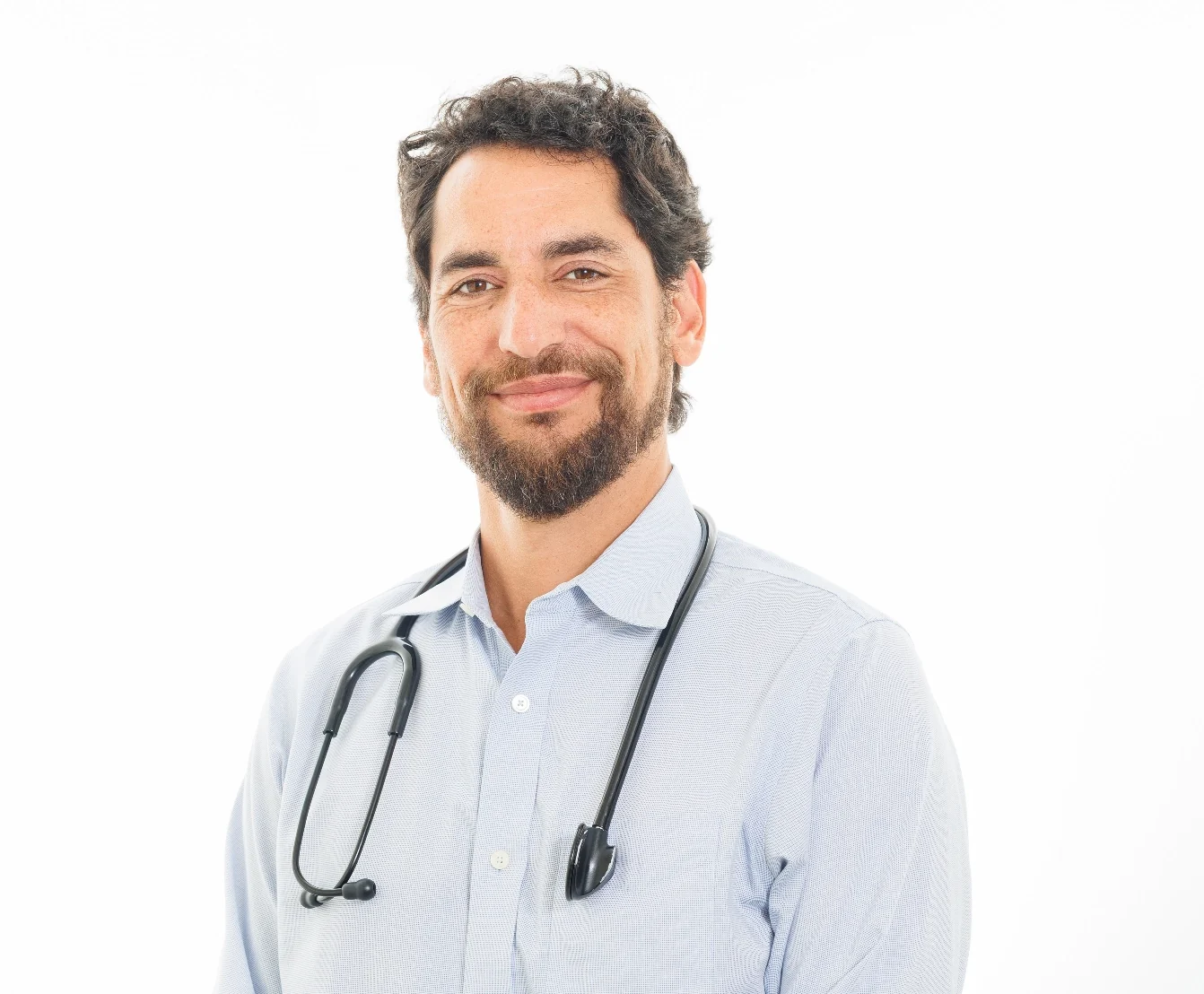 Dr. Richard Hallenbeck, pediatrician, smiling with a stethoscope